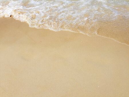 Sand beach by the sea as wallpaperの写真素材