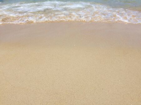Sand beach by the sea as wallpaperの写真素材
