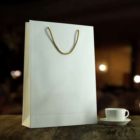 3d rendered mockup illustration Empty blank template of a white paper shopping bag for purchases on a wooden table with a white coffee cupの写真素材