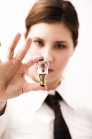 Attractive young girl holding lightbulb