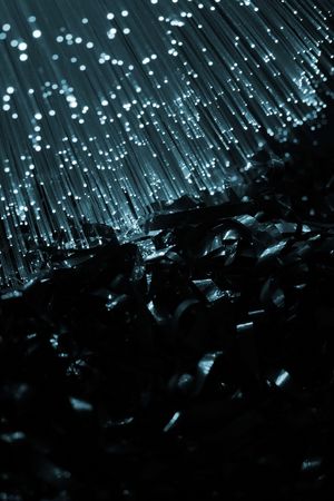 Fiber optics background with lots of blue light spotsの写真素材