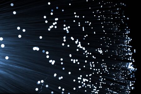 Fiber optics background with lots of light spotsの写真素材