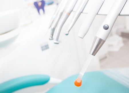 Metallic dentist tools close up on a dentist chair in Dentist Clinic の写真素材