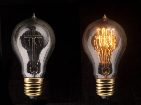 One glowing light bulb amongst other light bulbs, concept of idea の写真素材