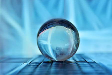 Notebook with Globe network conceptの写真素材