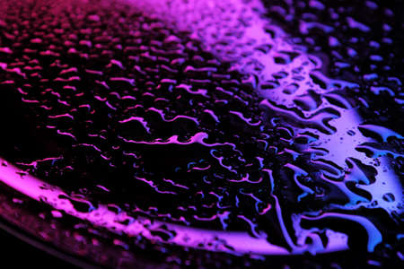 abstraction of a bokeh water drop green blurred