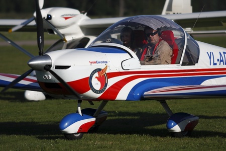 Ultralight aircraft Eirostar on grass airfield Adazi, Latvia, august 2011