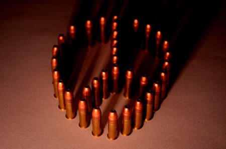 peace symbol written with ammonitionの写真素材