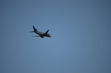 passenger aircraft on blue skyのeditorial素材