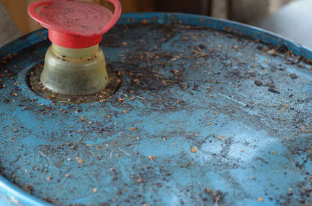 Blue oil drum barrel top with red pouring capの写真素材