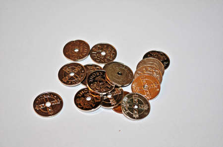 norwegian one crown currency coins isolated on white backgorundの写真素材