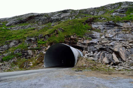 mountain tunnel opening in summerの写真素材
