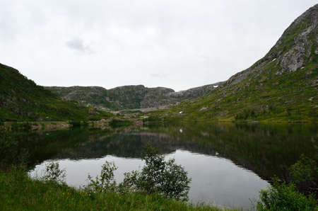 serne silent reflective mountain lake in summer