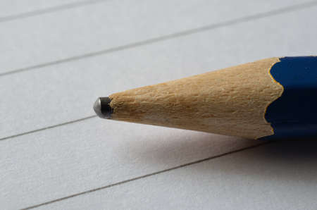Blue pencil tip on a notepadの写真素材
