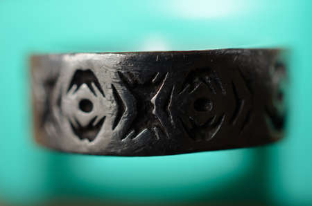 Metal finger ring with symbols close upのeditorial素材