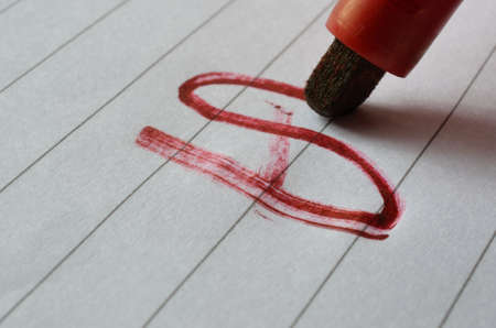 Drawing red lines with a red marker penの写真素材