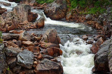 Fantastic fishing river running through the landscape on the mountain of Kaperdalen on the island of Senjaの写真素材