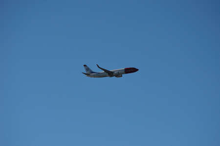 Norwegian aircraft coming in for landing in Tromsø city