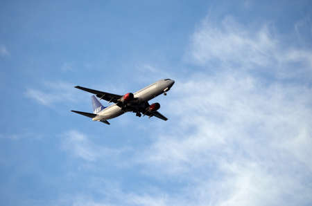SAS, Scandinavian Airlines plane coming in for landing on a beautiful clear and sunny autumn dayのeditorial素材