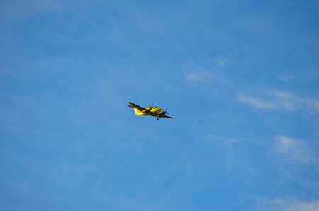 Emergency medical airplane coming in for landing on blue skyのeditorial素材