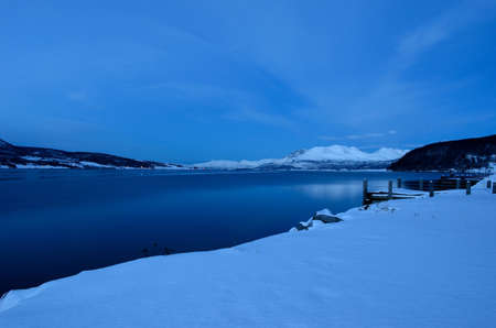 cold winter fjord landscape in winterの写真素材