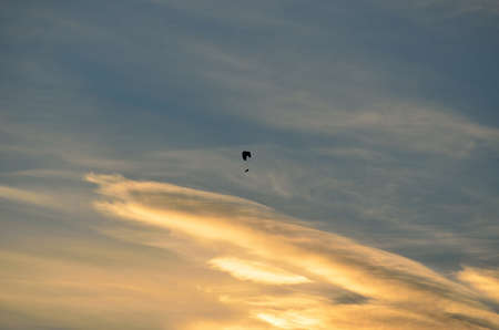 paraglider on dawn skyの写真素材