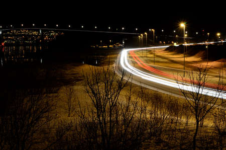 beautiful car traffic lights at night creates long white and red lines in the nightの写真素材