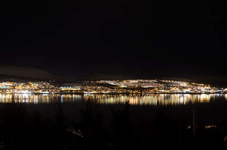 vivid and bright tromsoe city island at night timeの写真素材