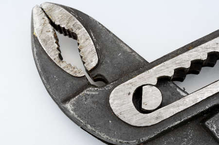 black water pump pliers isolated on white background macro photoの写真素材