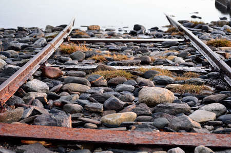 old rusted boat landing ramp on sea shoreの写真素材