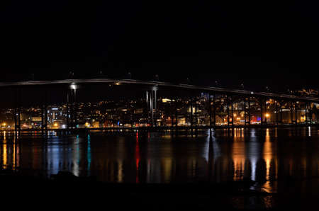 tromsoe city island at night with the bridge connecting the island to the mainlandのeditorial素材