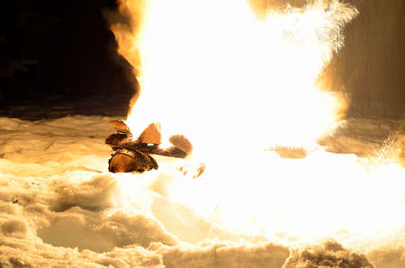 massive fire in winter snowy natureの写真素材