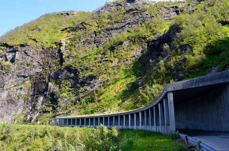 semi tunnel in mountain side on senja island for falling rock protectionの写真素材