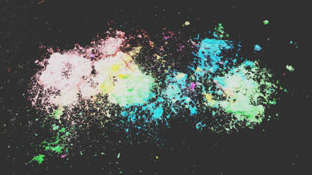 Colourful chalk dust on black surface