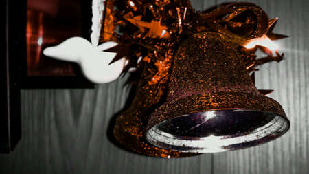Christmas bell with bowtie on wall