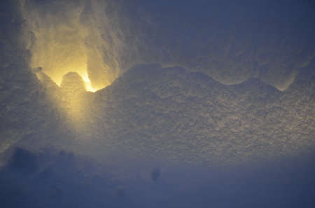 illuminated snow wall in winterの写真素材