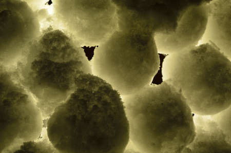 stacked snowball wall illuminated in winter nightの写真素材