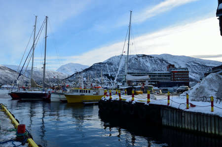 different boats docket in tromsoe city harbour on a sunny blue day 20th february 2016のeditorial素材