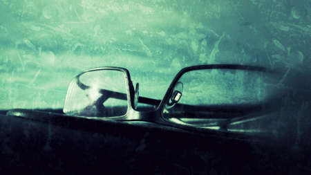 Glasses on car dashboardの素材