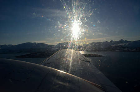 snowy mountain,sunshine and sea aerial shotの写真素材