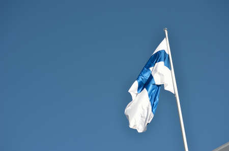 finland flag on blue summer skyの写真素材