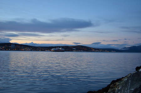 TROMSOE, NORWAY SEPTEMBER 29, 2016: The Norwegian coastal express, Hurtigruten, leaving Tromsoe city. The coastal express sails the lenght of Norway from south to north and north to southのeditorial素材