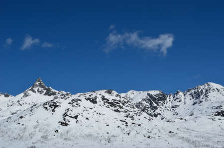 warm sunshine on snowy mountain in springtime in northern Norway