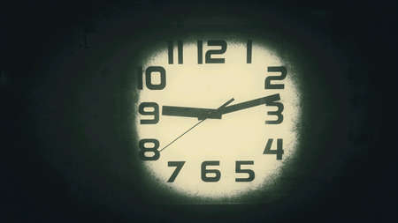 White clock on dark backgroundの素材