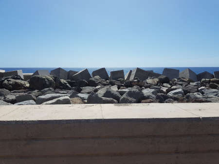 Blue ocean with massive stone casting on the canary islandsの写真素材