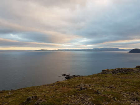 beautiful settlement of honningsvaag in northern norway at dusk with mountains and seaの写真素材
