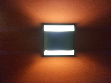 Lamp on the wall in an empty room, with copy space