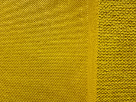 Closeup detail of yellow fabric texture background. Yellow fabric texture.