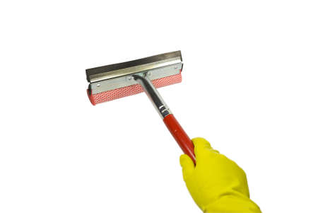 The hand in a yellow rubber glove holds a screen wiper. On a white backgroundの写真素材