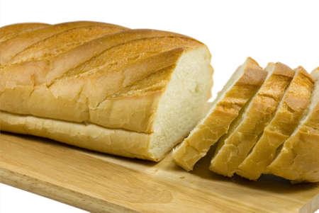 White bread is cut on pieces. On a white background